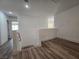 Second floor hallway featuring hardwood floors and views into adjacent rooms at 6638 Babys Tear Pl, Las Vegas, NV 89148