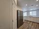 Kitchen with stainless steel refrigerator and white cabinets at 6638 Babys Tear Pl, Las Vegas, NV 89148