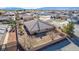 Aerial view showing the landscaping, block fence, and in-ground, fenced pool at 6781 Southgate St, Pahrump, NV 89061