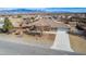 Stunning aerial view of a single-story home highlighting its landscaped yard at 6781 Southgate St, Pahrump, NV 89061