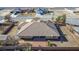 Home features an oversized lot with covered patio and mature landscaping at 6781 Southgate St, Pahrump, NV 89061