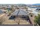 View of the backyard with brick patio and in-ground, fenced pool, mature landscaping, and shed at 6781 Southgate St, Pahrump, NV 89061