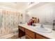 Bathroom featuring vanity and shower with decorative accents at 6781 Southgate St, Pahrump, NV 89061