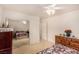 Inviting bedroom boasts mirrored closet doors and neutral carpet, flooded with natural light at 6781 Southgate St, Pahrump, NV 89061