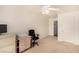 Carpeted bedroom is painted white and offers an office space and an ensuite bathroom at 6781 Southgate St, Pahrump, NV 89061
