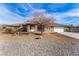 Charming single-story home with desert landscaping, a stone driveway, and a well-manicured yard at 6781 Southgate St, Pahrump, NV 89061