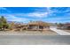 Charming single-story home with a well-manicured front yard and a driveway at 6781 Southgate St, Pahrump, NV 89061