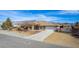 Beautiful single-story home with a spacious driveway and a two-car garage at 6781 Southgate St, Pahrump, NV 89061
