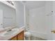 Bathroom featuring a tub/shower combo and single sink vanity at 690 Ambling Gait Ave, Henderson, NV 89015