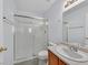 Bathroom featuring an updated glass shower enclosure and a single sink vanity at 690 Ambling Gait Ave, Henderson, NV 89015