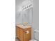 Bathroom with single sink vanity and standard toilet at 690 Ambling Gait Ave, Henderson, NV 89015