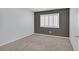 Bedroom with neutral carpet and white shuttered window at 690 Ambling Gait Ave, Henderson, NV 89015