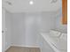 Bright laundry room equipped with a washer, dryer, and wire shelving at 690 Ambling Gait Ave, Henderson, NV 89015
