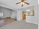Open floor plan with views into kitchen with granite countertops, and updated flooring at 690 Ambling Gait Ave, Henderson, NV 89015