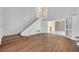 Spacious home with updated flooring, white staircase, and bright, open living spaces at 690 Ambling Gait Ave, Henderson, NV 89015