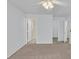 Main bedroom featuring carpeted floors and an ensuite bathroom at 690 Ambling Gait Ave, Henderson, NV 89015