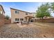 Enjoy this large backyard with mature trees, a stone landscape and a brick fire pit at 7028 Weavers Pl, North Las Vegas, NV 89084