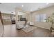 Bright living room with hardwood floors, area rug, recessed lighting, and plenty of natural light at 7028 Weavers Pl, North Las Vegas, NV 89084