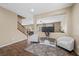 Open living area with hardwood floors, stairs, and recessed lighting, creating a welcoming atmosphere at 7028 Weavers Pl, North Las Vegas, NV 89084