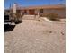 Ranch-style home with a front entrance accessed by exterior stairs at 7052 W Meranto Ave, Las Vegas, NV 89178