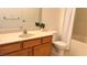 Bathroom featuring a wood vanity, and tile countertop, toilet, and shower with curtain at 7163 S Durango Dr # 113, Las Vegas, NV 89113