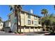 Exterior of building #16 featuring multiple garage doors, and palm trees at 7163 S Durango Dr # 113, Las Vegas, NV 89113