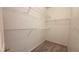 Spacious walk-in closet with carpeted flooring and multiple wire storage shelves at 7163 S Durango Dr # 113, Las Vegas, NV 89113