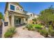 Home's backyard featuring a covered patio with beautiful landscaping and hardscape at 8048 Skye Bridge St, Las Vegas, NV 89166
