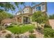 Inviting backyard with a small lawn area, low-maintenance landscaping, and a block wall at 8048 Skye Bridge St, Las Vegas, NV 89166