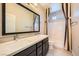 Well-lit bathroom with double sinks, a large mirror, and a shower-tub combination at 8048 Skye Bridge St, Las Vegas, NV 89166