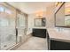 Luxurious bathroom with a glass-enclosed shower, soaking tub, and double vanity at 8048 Skye Bridge St, Las Vegas, NV 89166