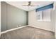 Cozy bedroom with neutral walls, plush carpeting, and natural light from a window at 8048 Skye Bridge St, Las Vegas, NV 89166