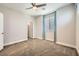 Comfortable bedroom with neutral walls, plush carpeting, and natural light from a window at 8048 Skye Bridge St, Las Vegas, NV 89166