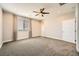 Bright bedroom with neutral walls, plush carpeting, and a window overlooking the yard at 8048 Skye Bridge St, Las Vegas, NV 89166
