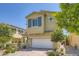 Charming two-story home with a well-maintained front yard and a two car garage at 8048 Skye Bridge St, Las Vegas, NV 89166