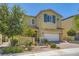 Charming two-story home with a well-manicured front yard and a two-car garage at 8048 Skye Bridge St, Las Vegas, NV 89166