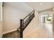 Bright hallway with a staircase and tiled floors, leading to a naturally lit living area at 8048 Skye Bridge St, Las Vegas, NV 89166
