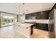 Modern kitchen with stainless steel appliances, a large island, and sleek cabinetry at 8048 Skye Bridge St, Las Vegas, NV 89166