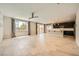 Bright open-concept living area with a fireplace and direct access to the modern kitchen at 8048 Skye Bridge St, Las Vegas, NV 89166