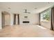 Bright, open living room featuring a modern fireplace, tile flooring, and ample natural light at 8048 Skye Bridge St, Las Vegas, NV 89166