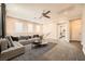 Relaxing upstairs living room featuring a comfortable sofa and plenty of natural light at 8048 Skye Bridge St, Las Vegas, NV 89166