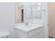 Clean, white bathroom features a modern vanity and ample lighting at 835 Aurelie Ridge St, Henderson, NV 89011
