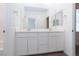 Modern bathroom features dual sink vanity with white cabinets and chrome fixtures at 835 Aurelie Ridge St, Henderson, NV 89011