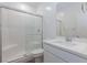 Bathroom with a modern tiled shower and a quartz vanity at 835 Aurelie Ridge St, Henderson, NV 89011