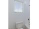 Bright bathroom featuring a toilet, shower/tub, and window letting in natural light at 835 Aurelie Ridge St, Henderson, NV 89011