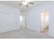Spacious bedroom with carpet flooring, closet, and access to other rooms through doorways at 835 Aurelie Ridge St, Henderson, NV 89011