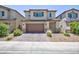 Charming two-story home with a two-car garage and low-maintenance landscaping at 835 Aurelie Ridge St, Henderson, NV 89011
