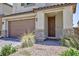 Close up of a well maintained home with a two car garage and low maintenance front yard at 835 Aurelie Ridge St, Henderson, NV 89011