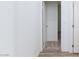 Hallway shows flooring and leads into the carpeted bedroom at 835 Aurelie Ridge St, Henderson, NV 89011
