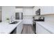 Well appointed kitchen featuring stainless appliances, quartz countertops, and neutral colors at 835 Aurelie Ridge St, Henderson, NV 89011